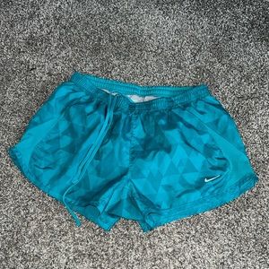 Blue Nike running shorts